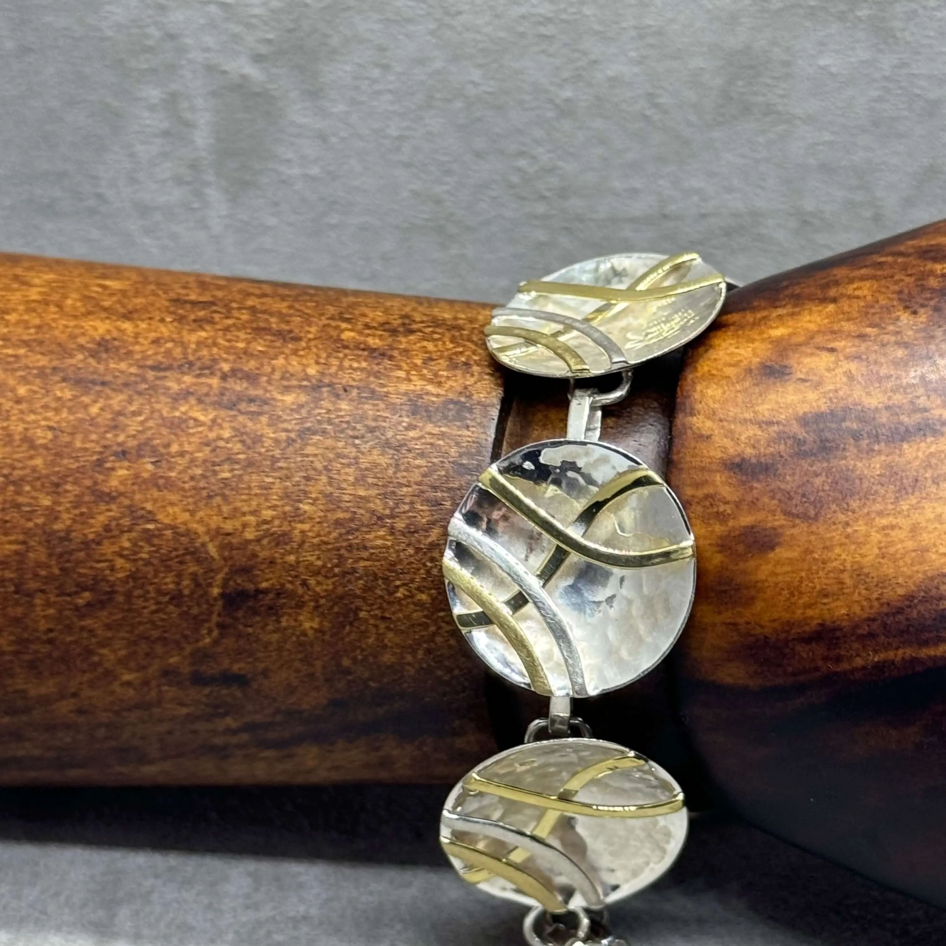 Hammered Sterling Silver Concave Disc Bracelet with Linear Brass Details