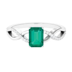 Octagon shape Emerald and Diamond Crossover Engagement Ring